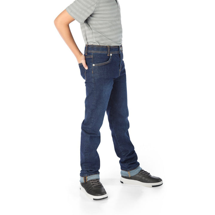 Tall Thin Boy Wearing Slim-Fit Jeans with Hands in Back Pockets